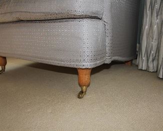 Detail of the front leg on the club chair.