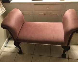 Rose colored vanity bench with rolled arms