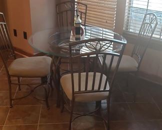 Glass top round table with 4 chairs