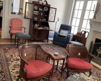 FABULOUS RUG IN LIVING ROOM OFF KITCHEN. BEAUTIFUL CANE BACK CHAIRS.