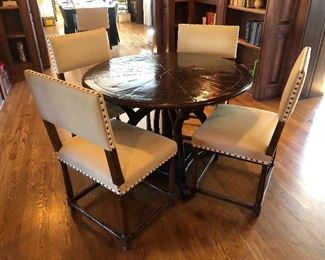 Charles Pollock dining table measuring 60” diameter x 29” high  and (4) Dennis & Leen Louis XIII side chairs measuring 21” wide x 21” depth x 37” high x 19” seat height 