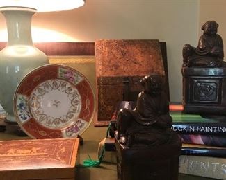 Jade reclining  Buddha statues/bookends from the late 1950s. Many antique boxes throughout the home.