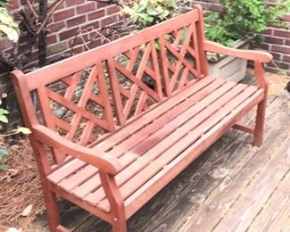 Beautiful Chippendale style garden bench in stained cedar
