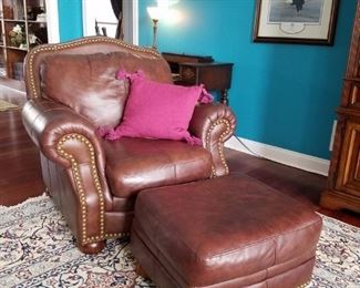 A closer look at one of the leather chairs and ottomans
