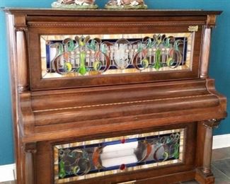 Player piano with stained glass panels