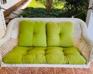 pair of wicker porch swings