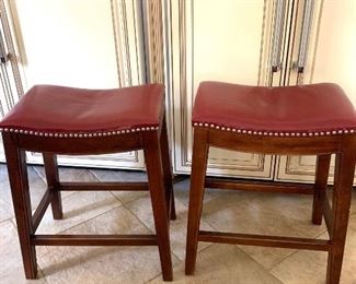 pair of red leather top stools, one SOLD & one is still available 