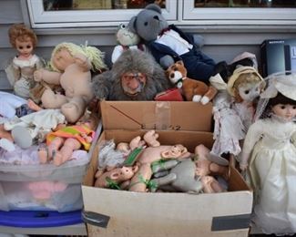 large assortment of dolls and collectible's