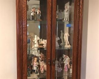 Beautiful curio cabinet with many figurines 