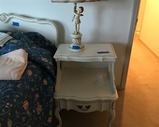 One of a pair of French style bedside tables