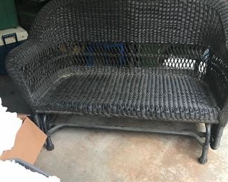 Wicker glider with two glider arm chairs.  Outdoor wicker