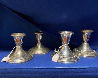 #50 $50- 2 pairs of sterling candleholders 3-1/2" and 3-3/4"H some denting