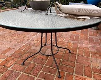 Lot#761 $95 wrought iron patio table with mesh top and glass top