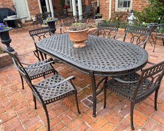 Lot#769 $450 metal oval patio table and 6 chairs
