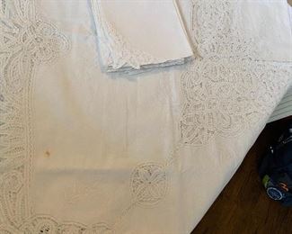 Lot #522 $65-Lace tablecloth 68"x102" with 9 napkins. a few small spots on tablecloth