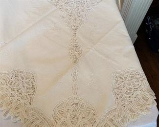 Lot#557 $95-Battenburg lace ivory tablecloth 98"x64". a few spots