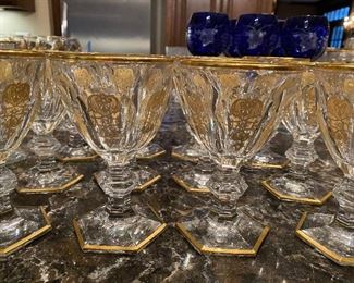 Lot#452 $350- 14 gold rimmed and footed hexagonal base stems. 6"H