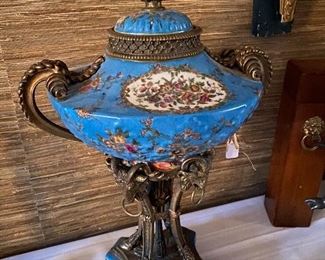 Lot#715 $350 Tall porcelain and metal urn. Lid has been repaired