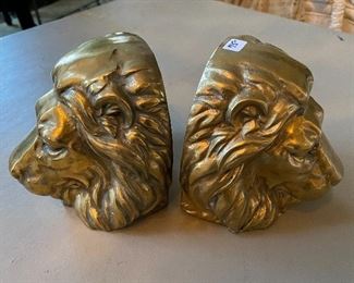 Lot#678 $75 Pair of brass lion head bookends