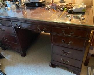 Lot#174 $450 Executive desk with leather top covered with glass. 5'W x 34"D x 30"H
