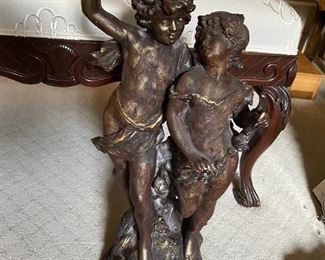 Lot#180 $100-Boy and girl statue. 21"H