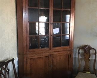 Lot #990- $3,300. Antique Cherry corner cabinet 
