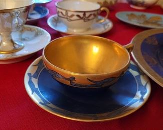 Assorted hand painted cups and saucers