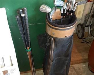 Vintage golf clubs one has a wood shaft