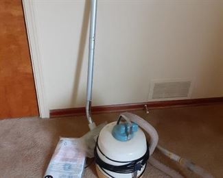 Vintage swiveling canister vacuum