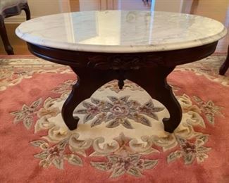 10- $150	Victorian style marble top oval table 			
34”L x 22”D x 17”H 
