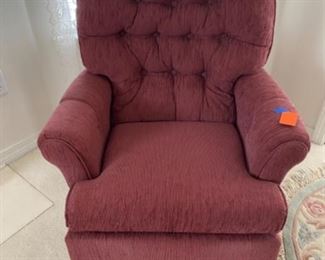 25- $50 Burgundy swivel chair 				
