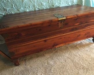 Antique Cedar chest adorned with unique brass trim