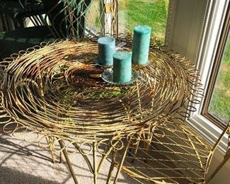 Antique woven metal ice cream table and chairs.