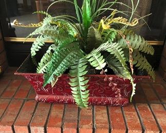 Large metal planter with greenery