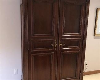 Lexington wardrobe closet with drawers and mirrors on doors inside