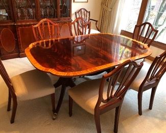 Baker dining table (2 leaves) with pads and 8 chairs (2 arm and 6 side - Shield Back style)