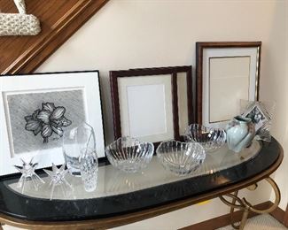 Baccarat vase, artwork, frames and crystal bowls, candle holders, and signed pottery vase