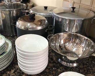 large lobster and stock pots, metal strainer, soup bowls, and vintage platter