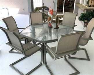 Outdoor Hexagon Table w/6 Chairs and patterned glass top measures 55" side to side or 61" point to point