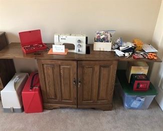 Bernina sewing machine, with cabinet and attachments.