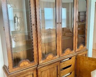 $795 - Henredon's 18th Century portfolio two piece china cabinet. THIS ITEM REQUIRES A PROFESSIONAL MOVER; Buffet has four doors with three pull out shelves in the middle cabinet. Hutch features four glass doors each with 3 adjustable glass shelves; 84"H x 76"W x 18 1/2"D