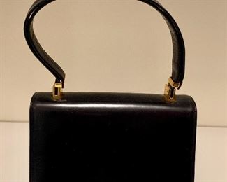 $40 - #12 Chic Koret black leather handbag with goldstone accents. 7 in. L x 9 1/2 in. H (perfect for a day strolling Madison Avenue)