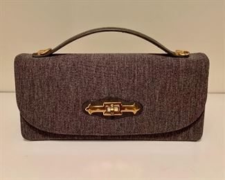 $24 - #11 Gray fabric rectangular purse with leather handle and gold accents; "Mm Jersey" mark, strap and change purse inside bag. 11 in. L x 5 1/2 in. H