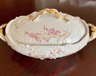 $30 - Covered porcelain two-handled vegetable dish; Limoges France; approx 3 in. H x 9 in. L; 5 1/2 in. overall H with cover