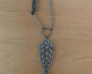 $20 -Silvertone fish necklace on chain. Jewelry #12; Fish length 4 1/2 in.; unclasped chain approx. 19 in.