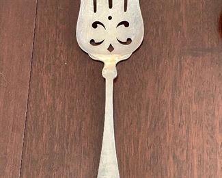 $150 - Heinrich & Anna Eicher Chicago hand wrought sterling serving fork; approx 10" long; makers mark and STERLING HAND WROUGHT 24 stamped on reverse