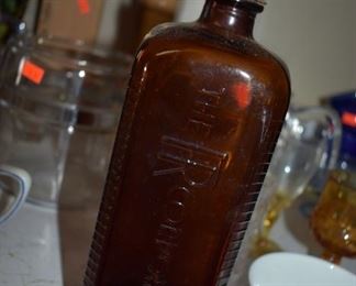 Antique Amber Bottle with original screw cap and the words, "the FR corporation" embossed on the side.