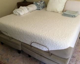 Full view of king bed with base - rug under bed