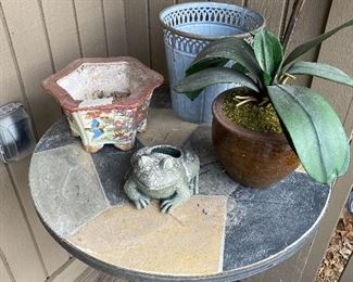 Outdoor table - $20; lanterns as follows - frog $6, artificial plant $5, basket look planter $7, ceramic flowered $6