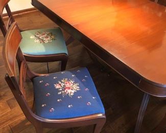 Set of 6 dining room chairs with needlepoint seats, Duncan Phyfe-style table with 2 leaves and pads